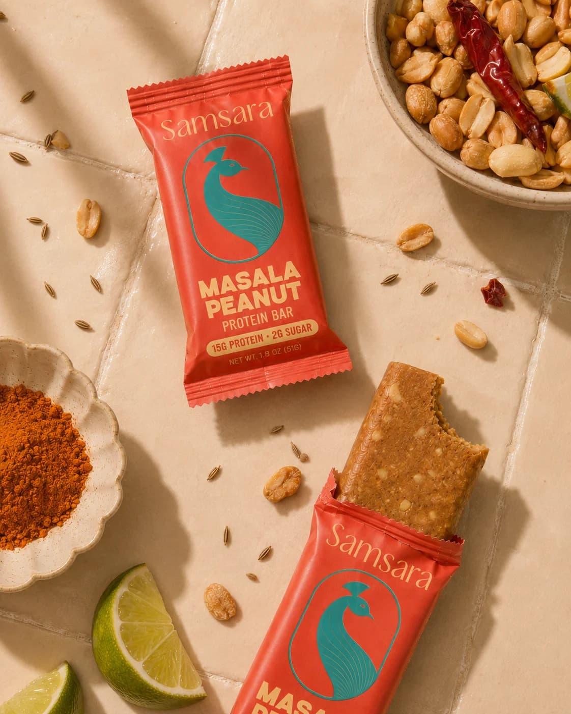 Masala Peanut bar with peanuts, chili, and lime on a cream tile counter